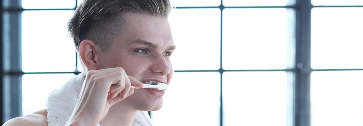 Man brushing teeth